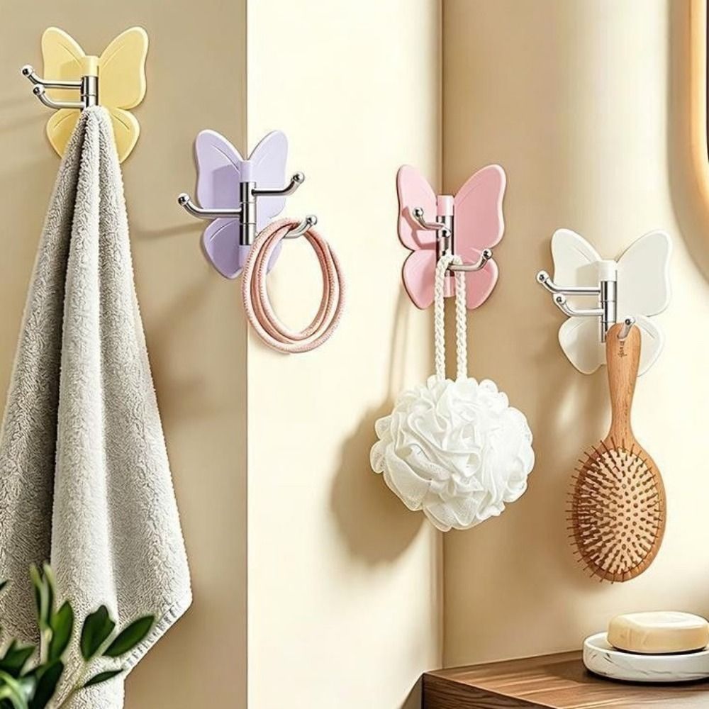 Wall Anchor Plastic - ตะขอแขวนผนังรูปผีเสื้อแบบหมุนได้ 4 ชิ้น ทำจากพลาสติก ติดผนังด้วยกาวในตัว ประหยัดพื้นที่
